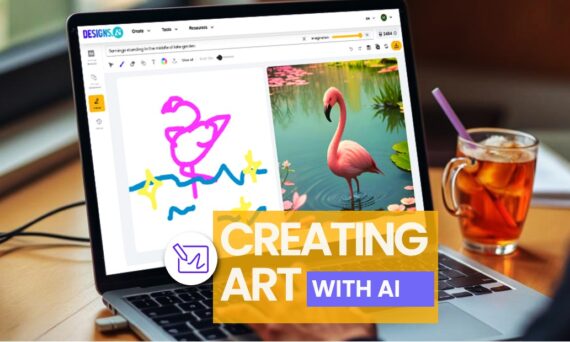 A laptop displaying the text "DESIGNS.CO CREATING ART WITH AI" on its screen, alongside a drink positioned nearby. The setting is indoors.